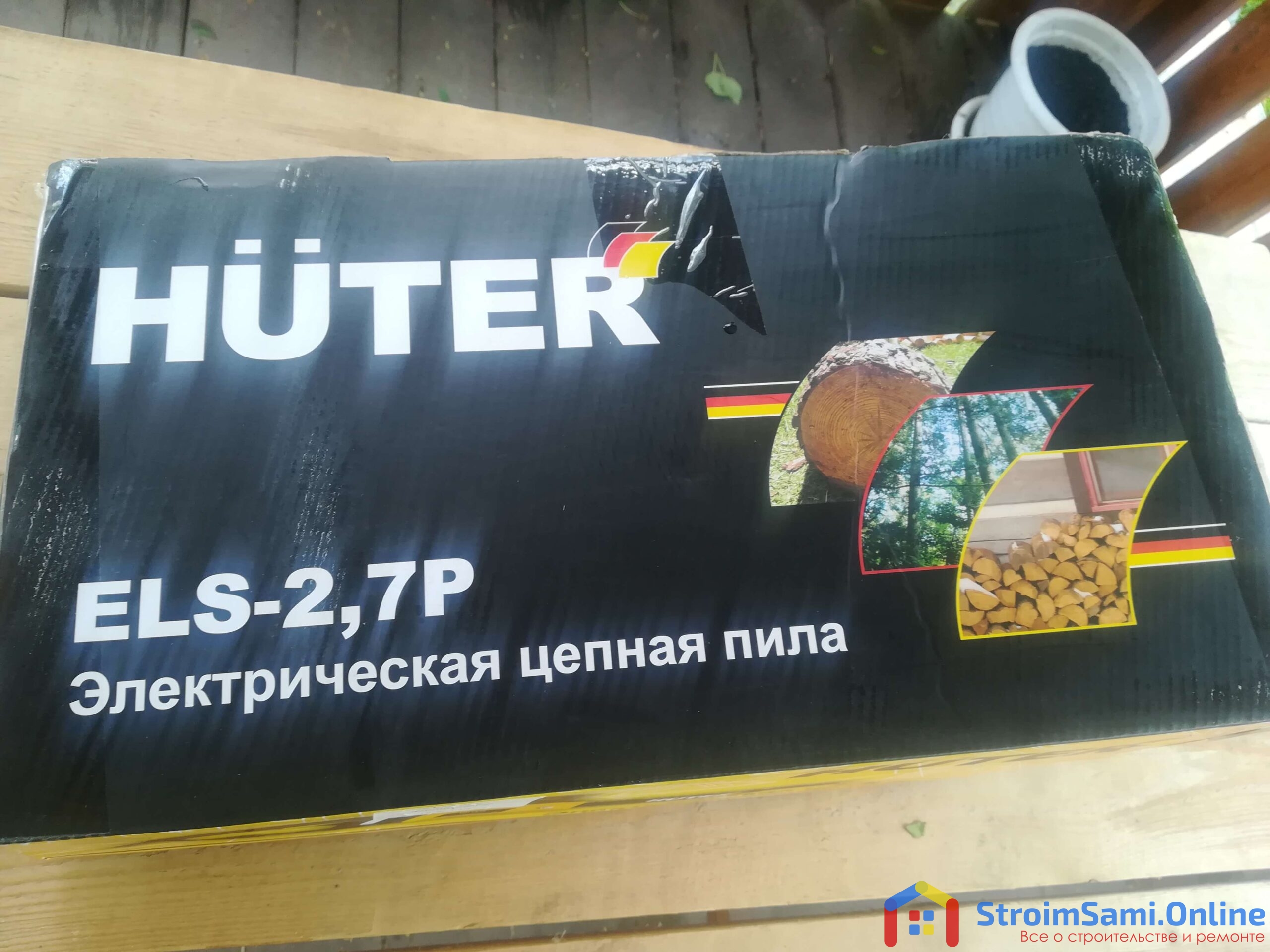 На фото: электрическая цепная пила Huter ELS-2,7P в заводской упаковке